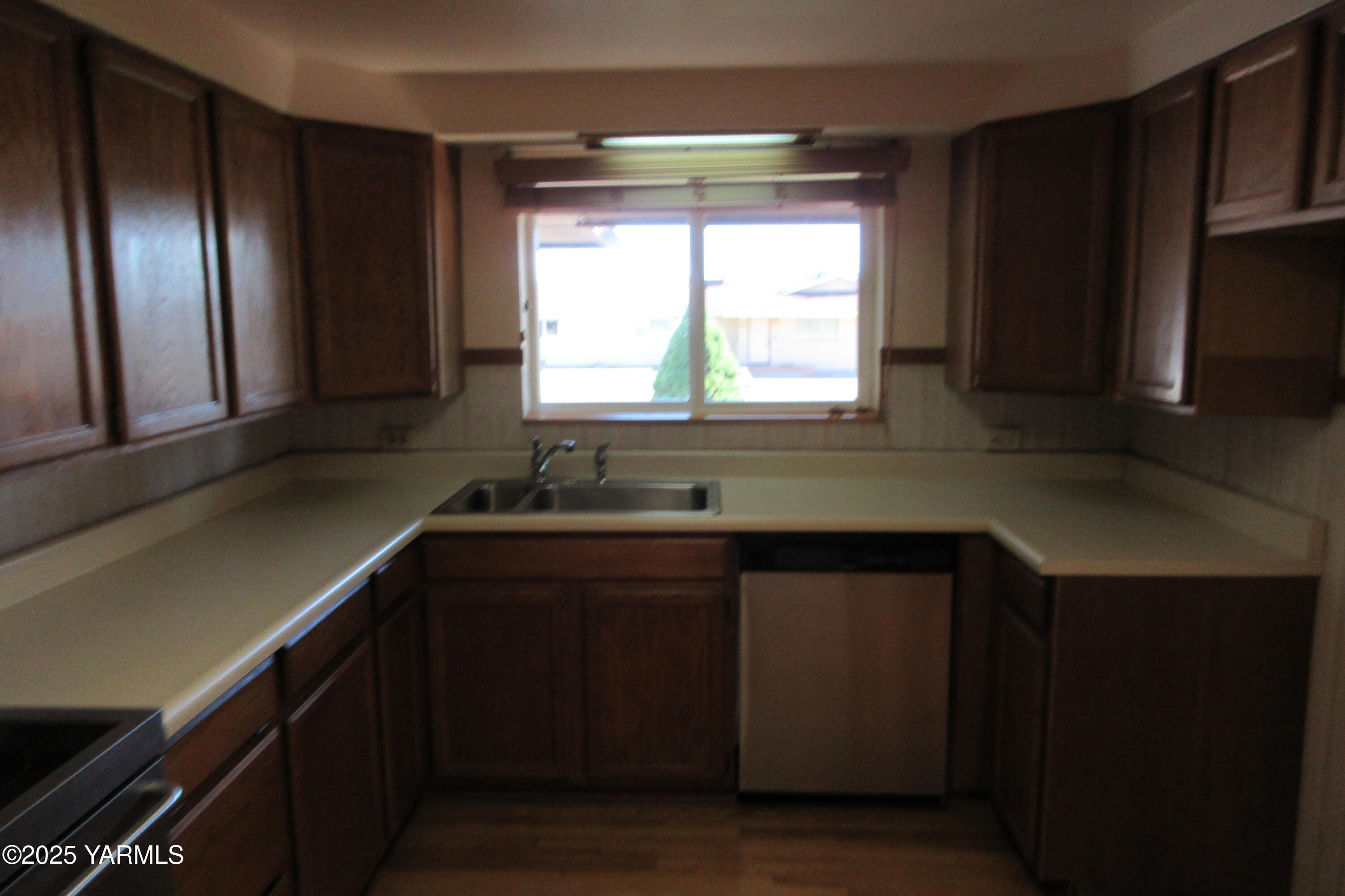 2703 Cascade Road Yakima, WA 98901 - Photo 12 of 24 a kitchen with granite countertop stainless steel appliances a sink stove and refrigerator