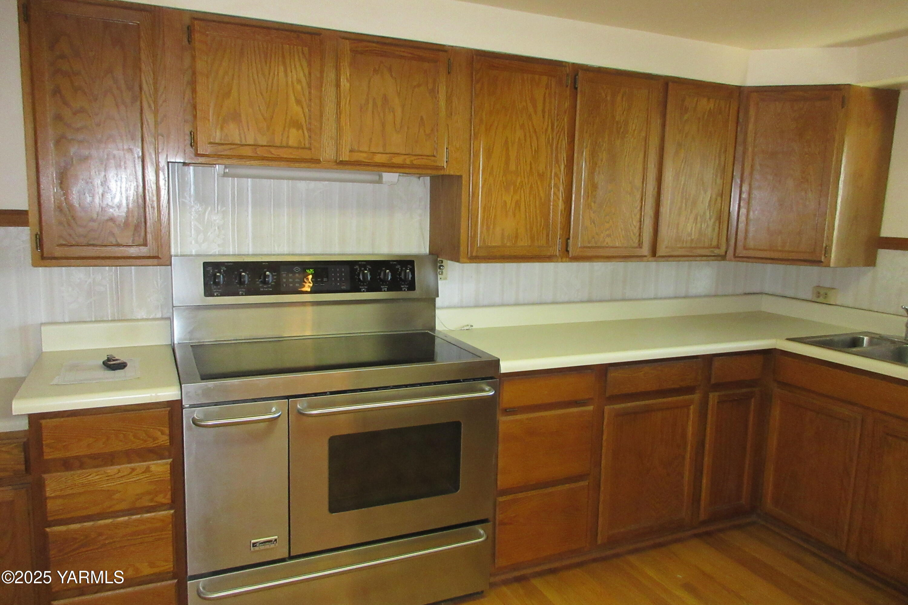 2703 Cascade Road Yakima, WA 98901 - Photo 13 of 24 a kitchen with granite countertop cabinets and steel stainless steel appliances