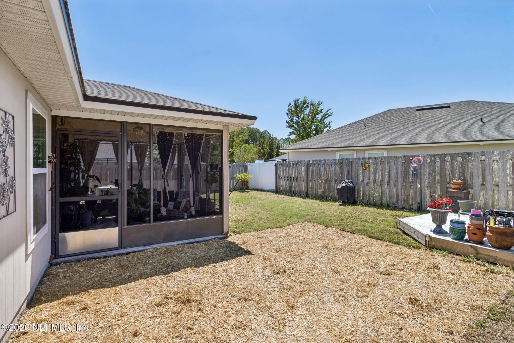 96034 Bass Lane Yulee, FL 32097 - Photo 43 of 50 a view of a house with a patio