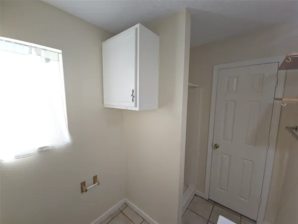 a white toilet sitting next to a bathroom sink and tub