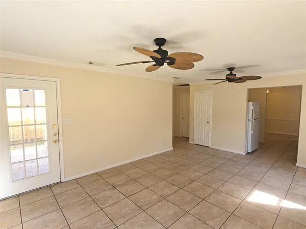 a view of a livingroom and a chandelier fan