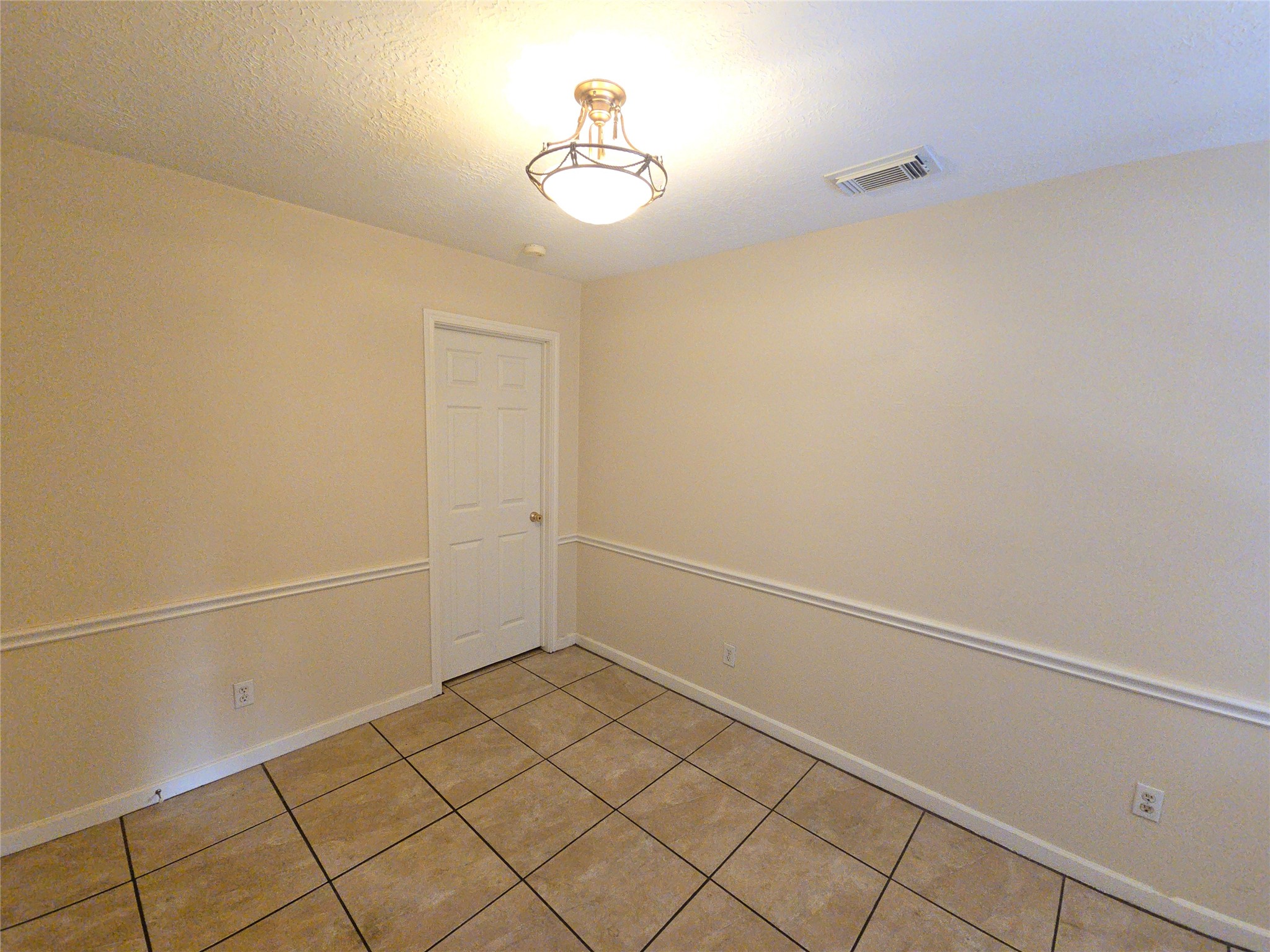 409 Commerce Street Tomball, TX 77375 - Photo 8 of 25 a view of a room with racks on the wall