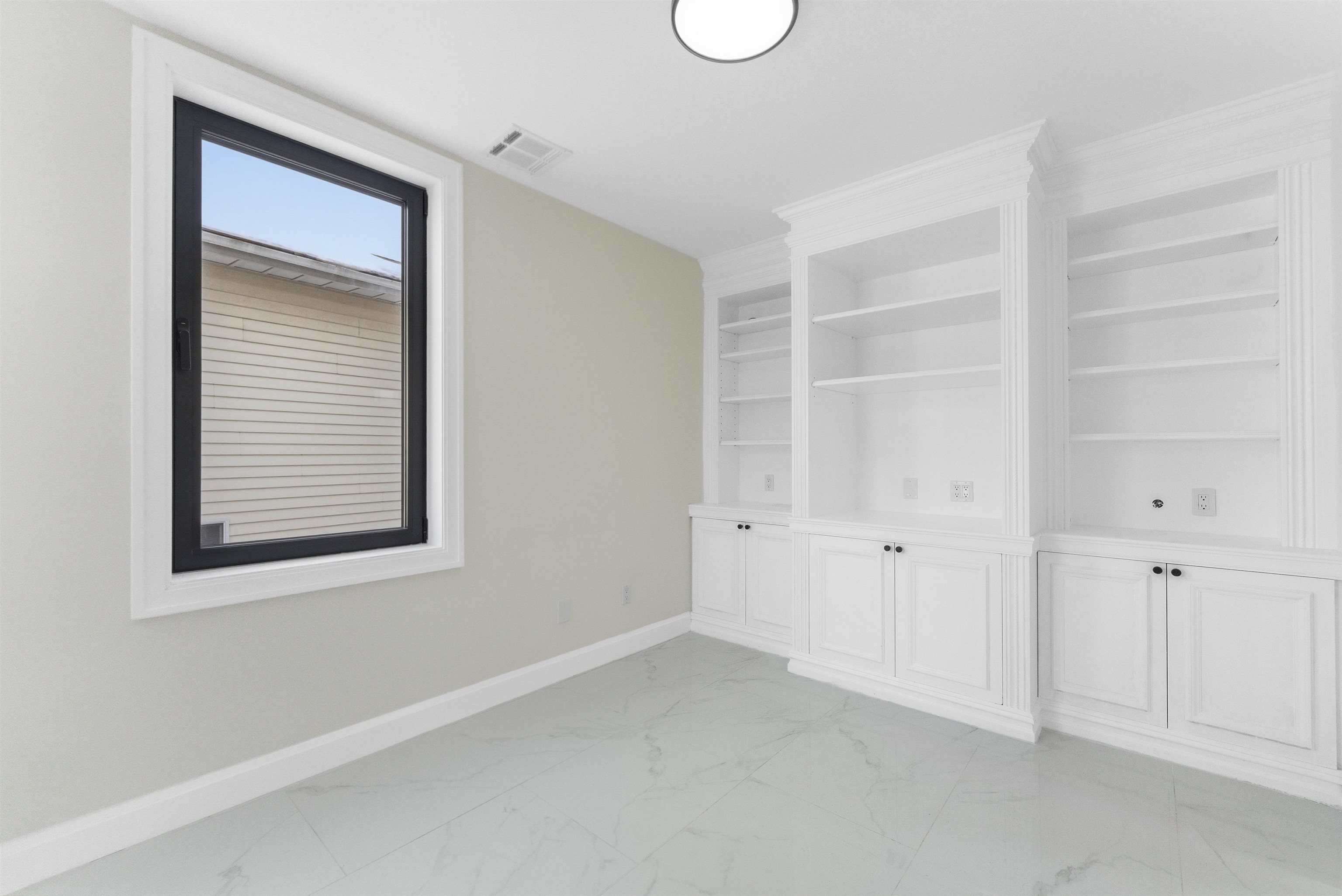 703 3rd Street Secaucus, NJ 07094 - Photo 15 of 49 a view of an empty room with a window