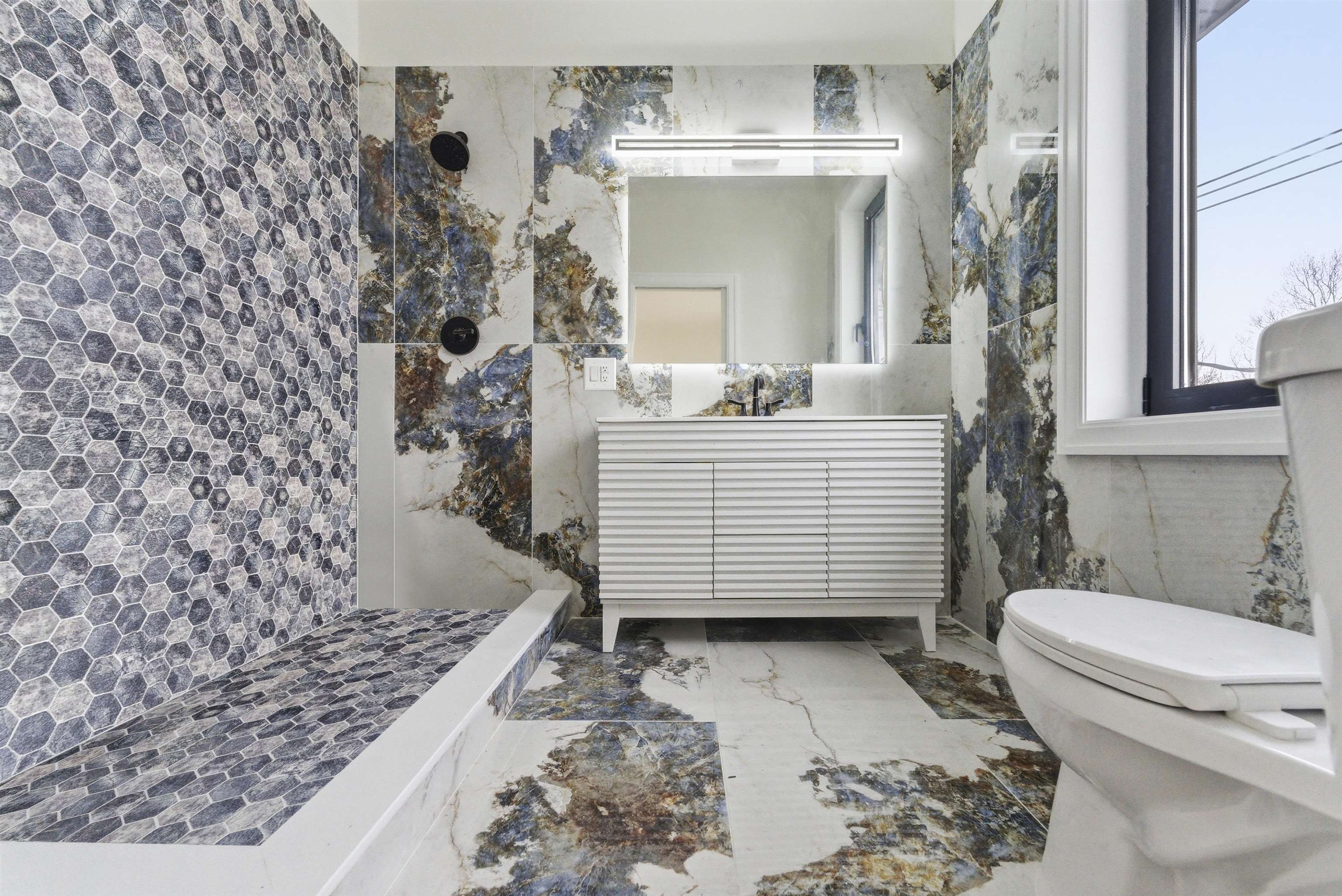 703 3rd Street Secaucus, NJ 07094 - Photo 25 of 49 a bathroom with a sink toilet and shower