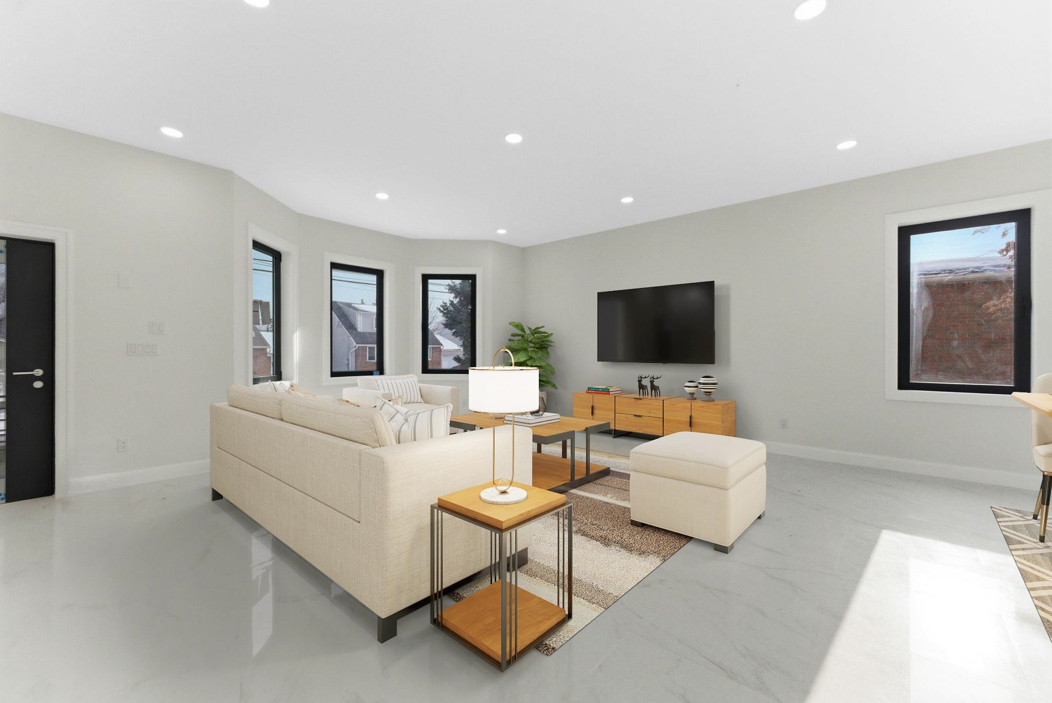 703 3rd Street Secaucus, NJ 07094 - Photo 3 of 49 a living room with furniture and a flat screen tv