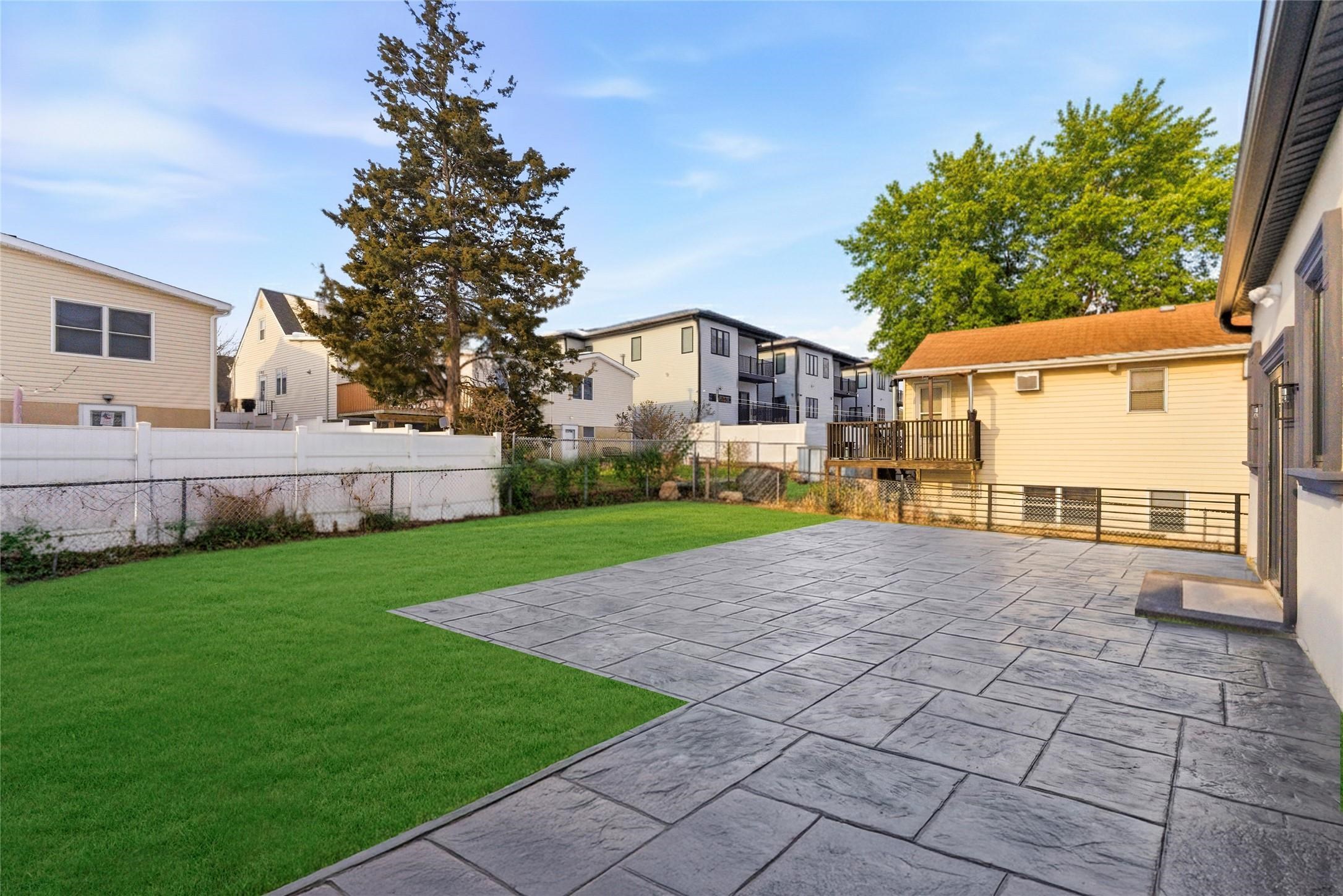 703 3rd Street Secaucus, NJ 07094 - Photo 43 of 49 a view of a yard with a house