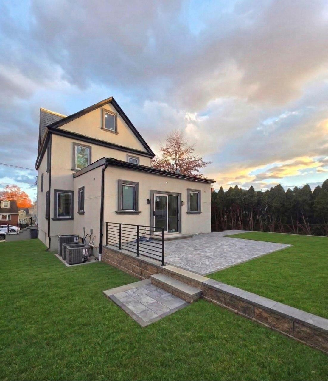 703 3rd Street Secaucus, NJ 07094 - Photo 44 of 49 a front view of house with yard and outdoor seating