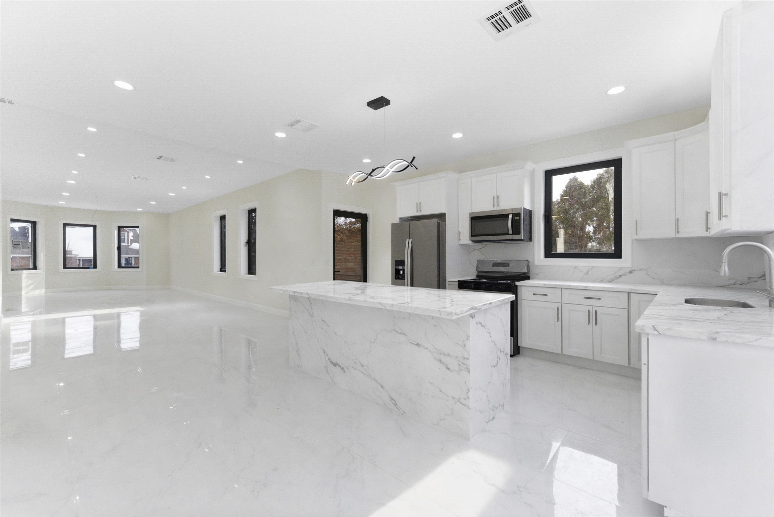 703 3rd Street Secaucus, NJ 07094 - Photo 9 of 49 a large white kitchen with lots of counter space sink and appliances