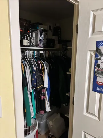 a bedroom with a bed dresser and a window