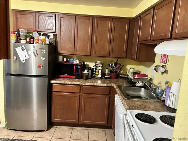 a kitchen with a sink and a stove