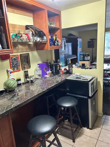 a kitchen with stainless steel appliances granite countertop a stove and a microwave