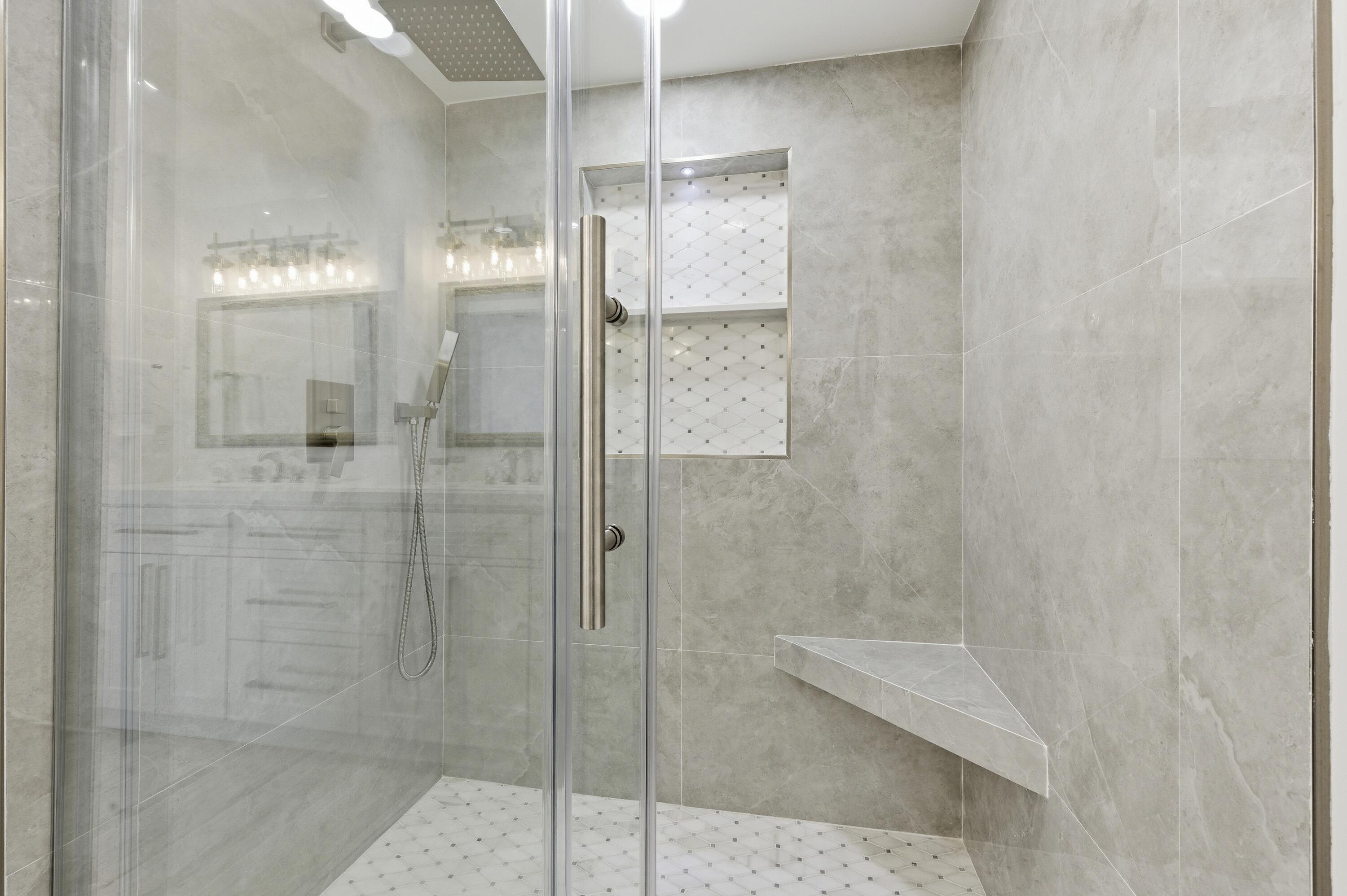 3520 South Ocean Boulevard, Unit H502 South Palm Beach, FL 33480 - Photo 13 of 35 a bathroom with a glass shower door