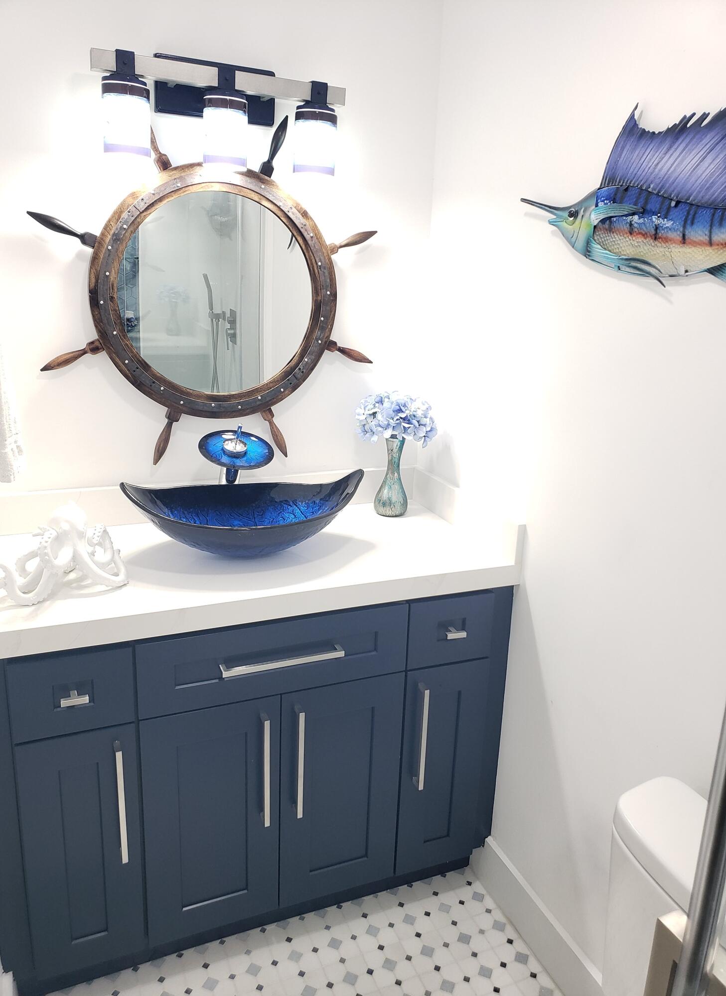 3520 South Ocean Boulevard, Unit H502 South Palm Beach, FL 33480 - Photo 18 of 35 a bathroom with a sink a mirror and toilet