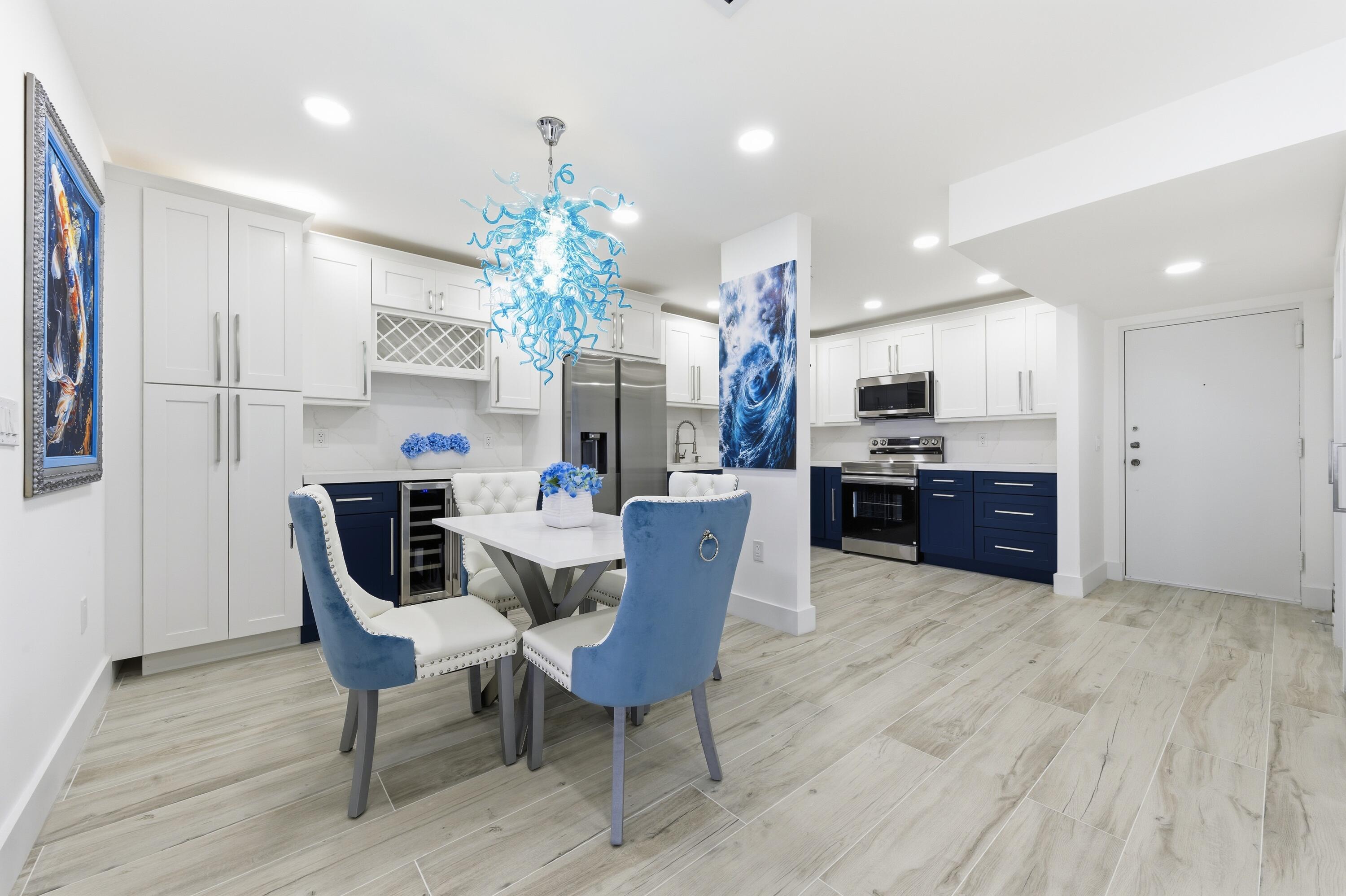 3520 South Ocean Boulevard, Unit H502 South Palm Beach, FL 33480 - Photo 2 of 35 a view of a dining room with furniture and a chandelier