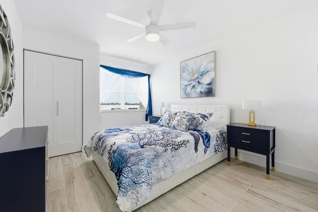 a bedroom with a bed and a table