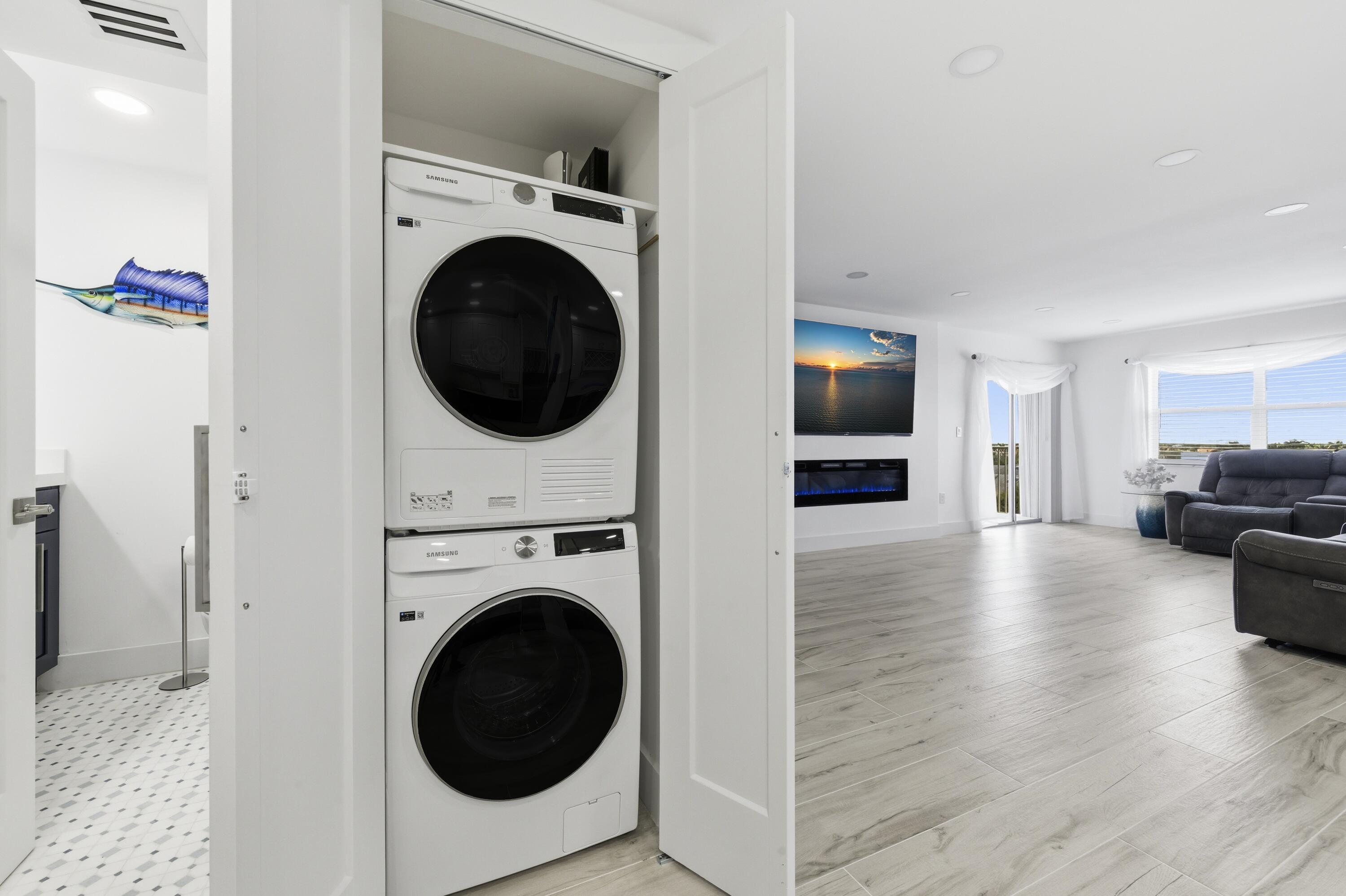 3520 South Ocean Boulevard, Unit H502 South Palm Beach, FL 33480 - Photo 24 of 35 a view of a livingroom with furniture washer and dryer