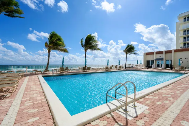 a view of a swimming pool with a lounge chairs