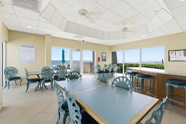 a view of a dining room with furniture window and outside view