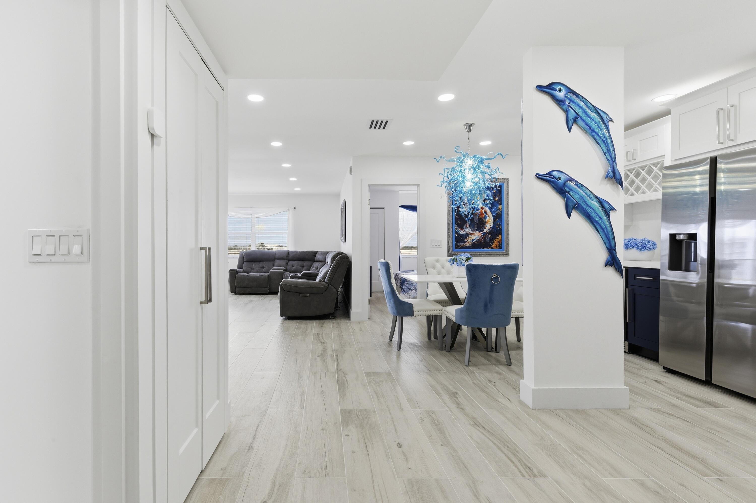 3520 South Ocean Boulevard, Unit H502 South Palm Beach, FL 33480 - Photo 6 of 35 a living room with furniture and a wooden floor