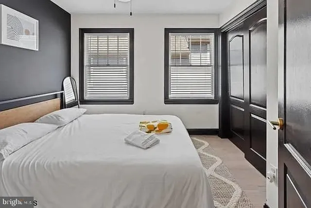 a bedroom with a bed and a window