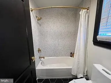 a balcony view with a seating space