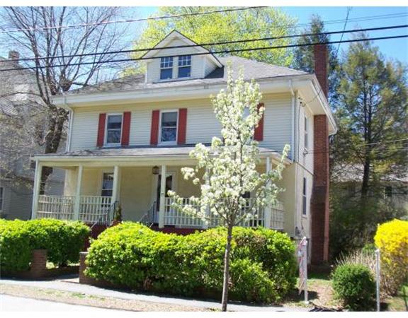 57 Huntington Road Milton, MA 02186 - Photo 1 of 1 a front view of a house with a garden