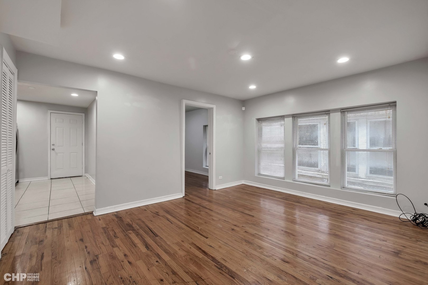 1052 North Springfield Avenue Chicago, IL 60651 - Photo 15 of 31 a view of empty room with wooden floor and fan