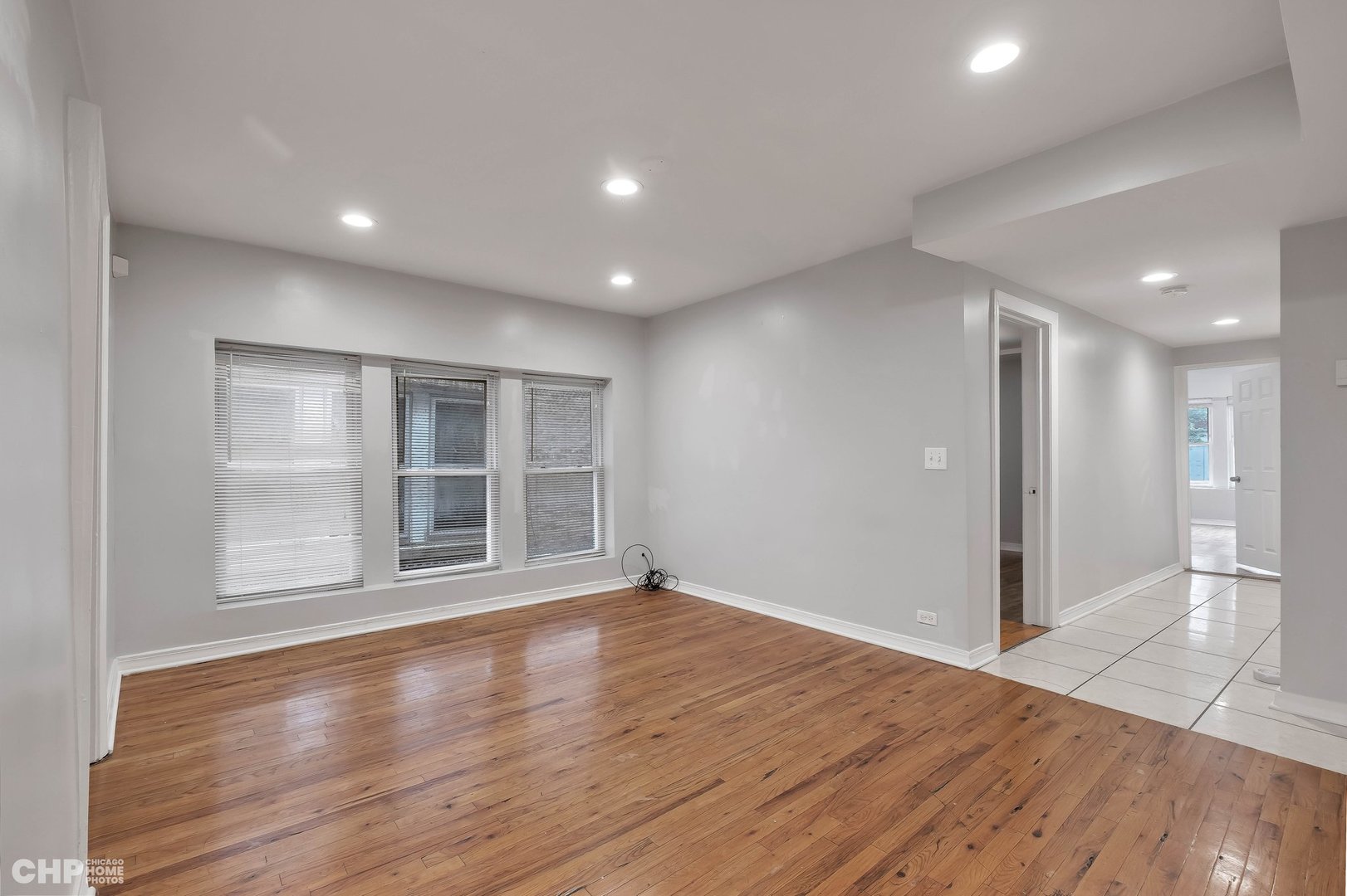 1052 North Springfield Avenue Chicago, IL 60651 - Photo 16 of 31 a view of empty room with wooden floor and windows