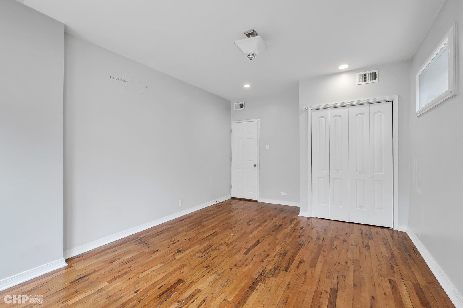 1052 North Springfield Avenue Chicago, IL 60651 - Photo 17 of 31 a view of hallway with wooden floor