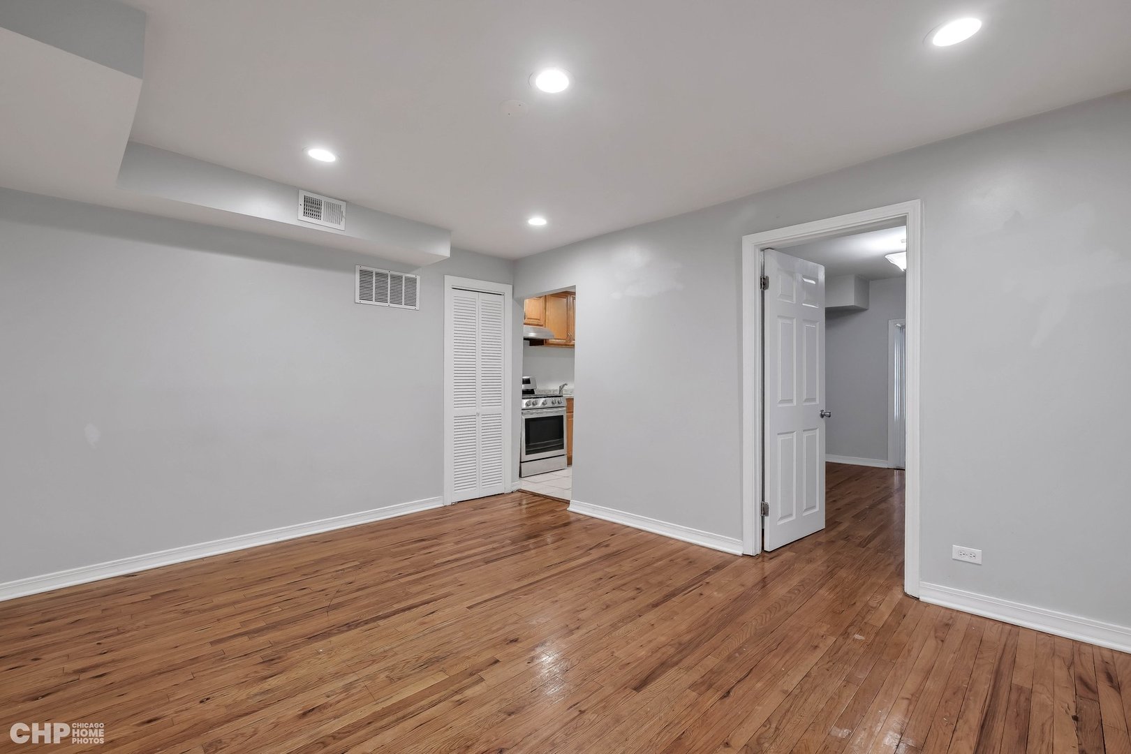 1052 North Springfield Avenue Chicago, IL 60651 - Photo 18 of 31 a view of empty room with wooden floor