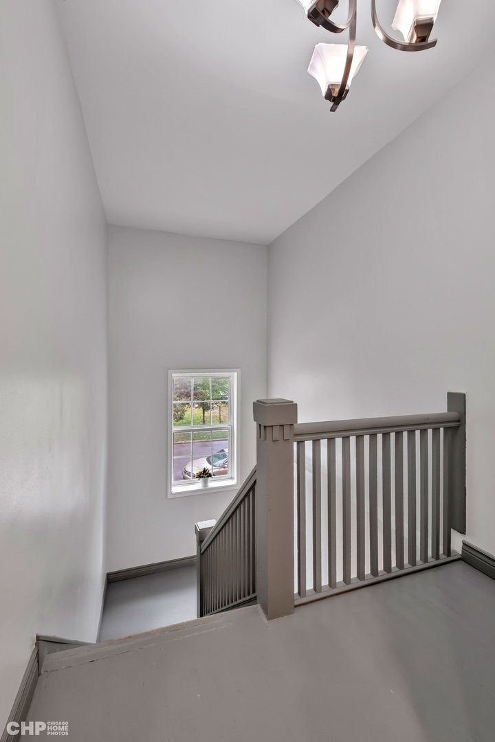 1052 North Springfield Avenue Chicago, IL 60651 - Photo 19 of 31 a view of a hallway with windows