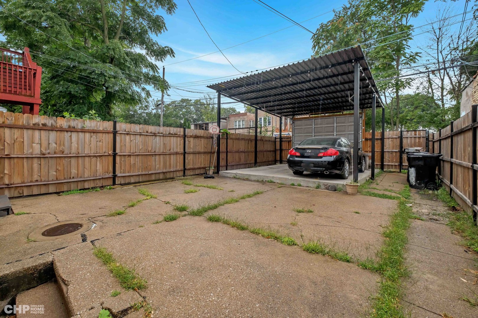 1052 North Springfield Avenue Chicago, IL 60651 - Photo 29 of 31 a view of backyard with car parked