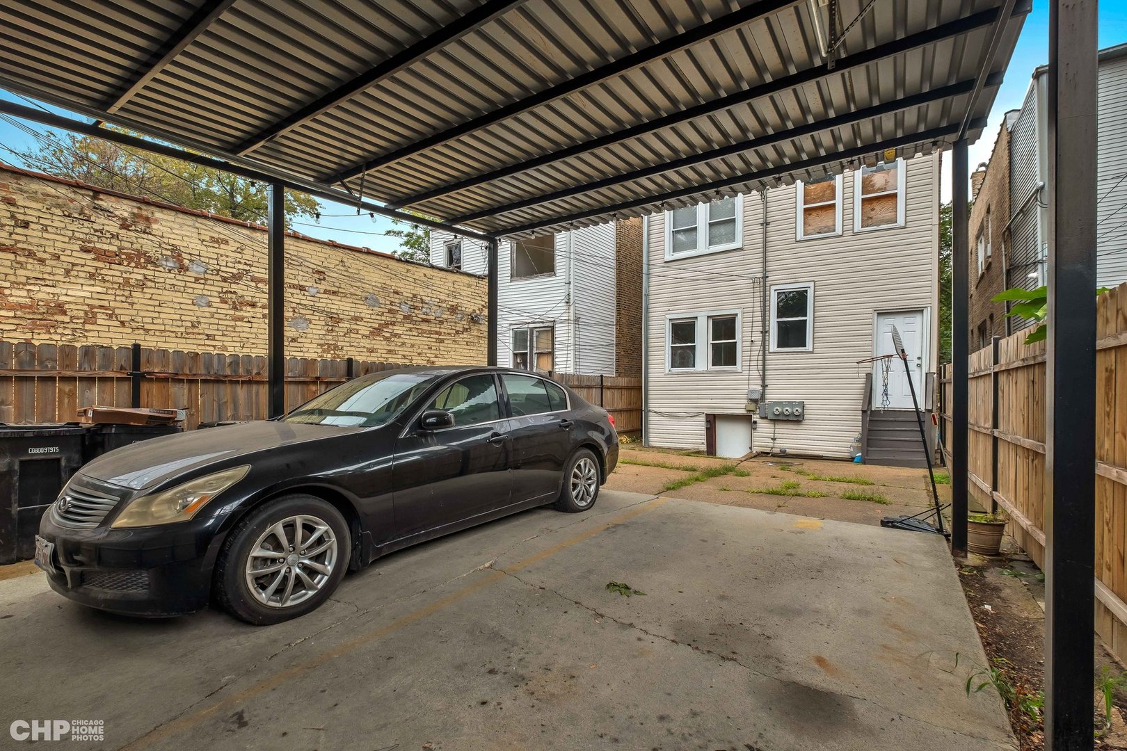 1052 North Springfield Avenue Chicago, IL 60651 - Photo 31 of 31 a car parked in front of a house