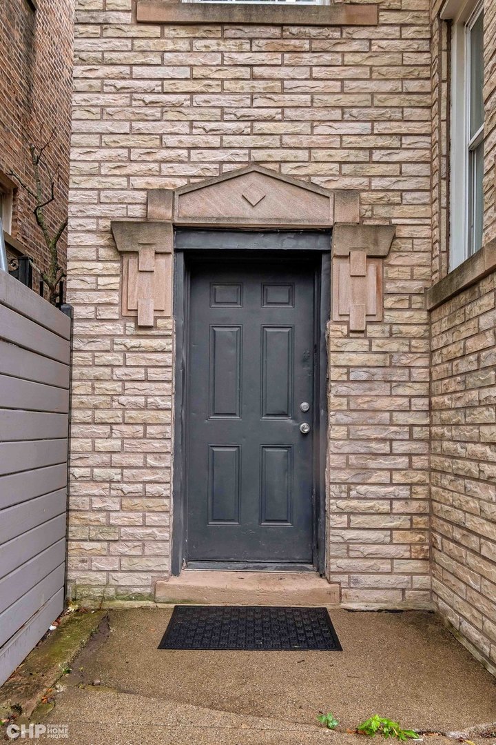 1052 North Springfield Avenue Chicago, IL 60651 - Photo 4 of 31 a view of a entryway door of the building