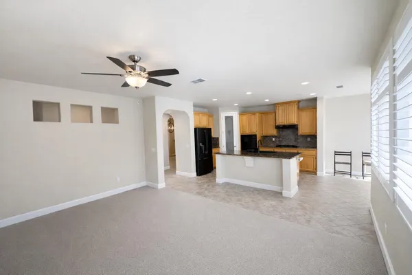 a view of kitchen with refrigerator stove and microwave