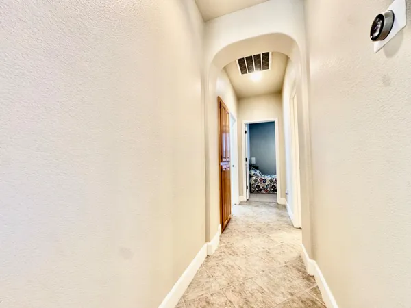 a view of a hallway with a yellow and a door