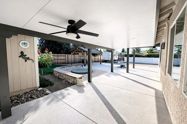 a view of swimming pool with outdoor seating and plants
