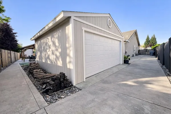 a balcony with outdoor seating and wooden floor