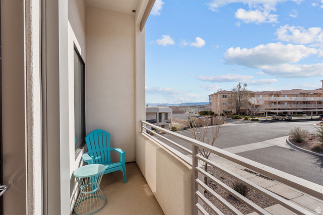 1122 South 1790th West, Unit 1 St. George, UT 84770 - Photo 4 of 37 Private balcony featuring a light-colored railing, exterior wall, and concrete flooring