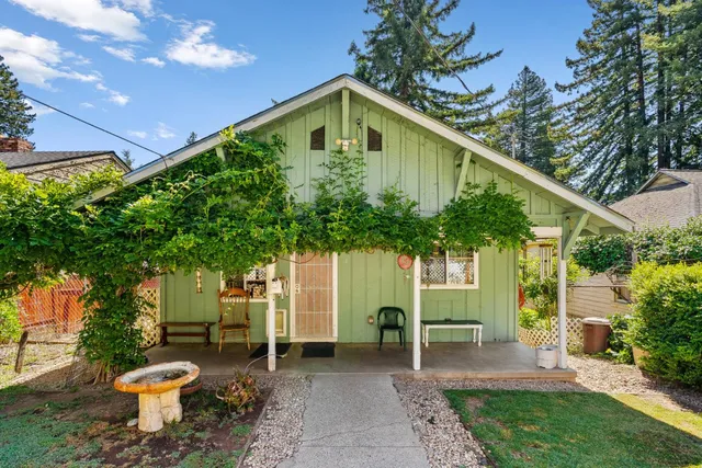 a front view of a house with garden
