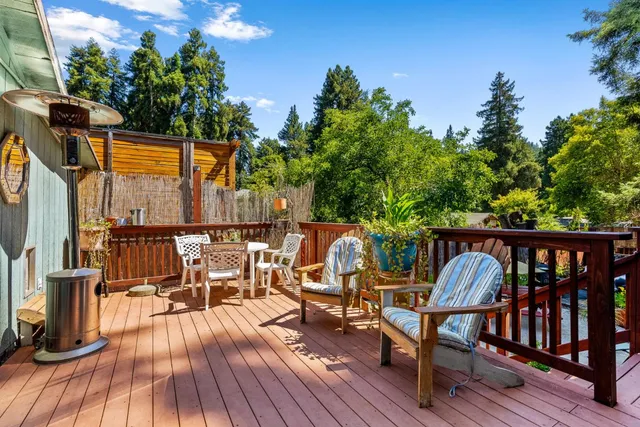 a view of a chairs and table in patio