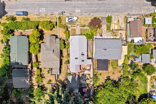 an aerial view of house with yard swimming pool and outdoor seating