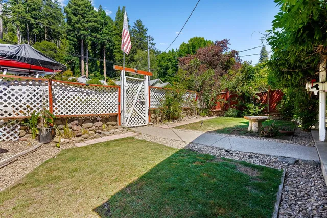 a living room with furniture a wooden floor and a window