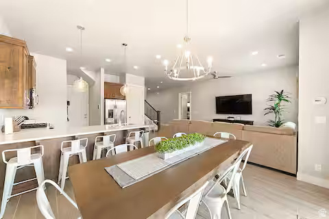 2600 Ocotillo Way, Unit 56 Santa Clara, UT 84765 - Photo 5 of 33 Dining space with a chandelier, stairs, light wood-style floors, and recessed lighting