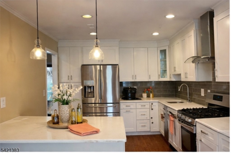 Undisclosed Address Edison, NJ 08820 - Photo 13 of 44 a kitchen with refrigerator a stove and cabinets