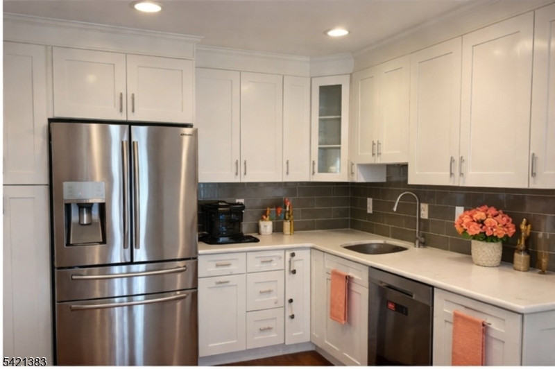 Undisclosed Address Edison, NJ 08820 - Photo 14 of 44 a kitchen with stainless steel appliances a refrigerator sink and cabinets