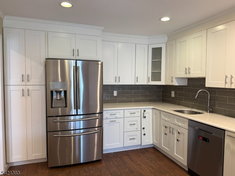 Undisclosed Address Edison, NJ 08820 - Photo 17 of 44 a kitchen with stainless steel appliances granite countertop a refrigerator sink and cabinets