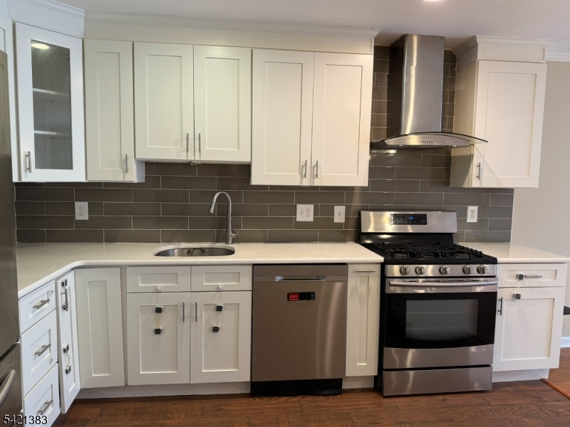 Undisclosed Address Edison, NJ 08820 - Photo 18 of 44 a kitchen with cabinets appliances and a sink