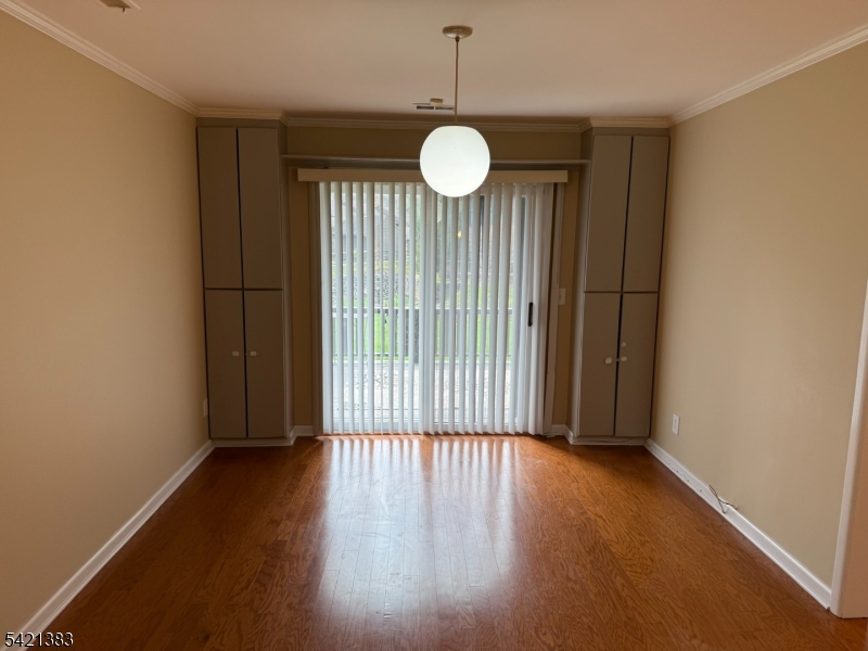 Undisclosed Address Edison, NJ 08820 - Photo 20 of 44 an empty room with wooden floor and windows