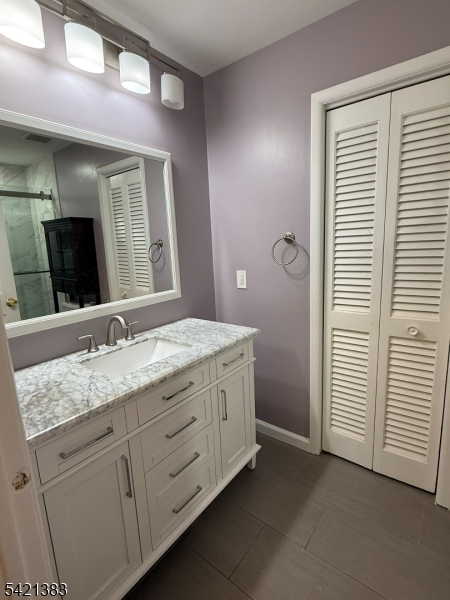 Undisclosed Address Edison, NJ 08820 - Photo 28 of 44 a bathroom with a granite countertop sink and a mirror